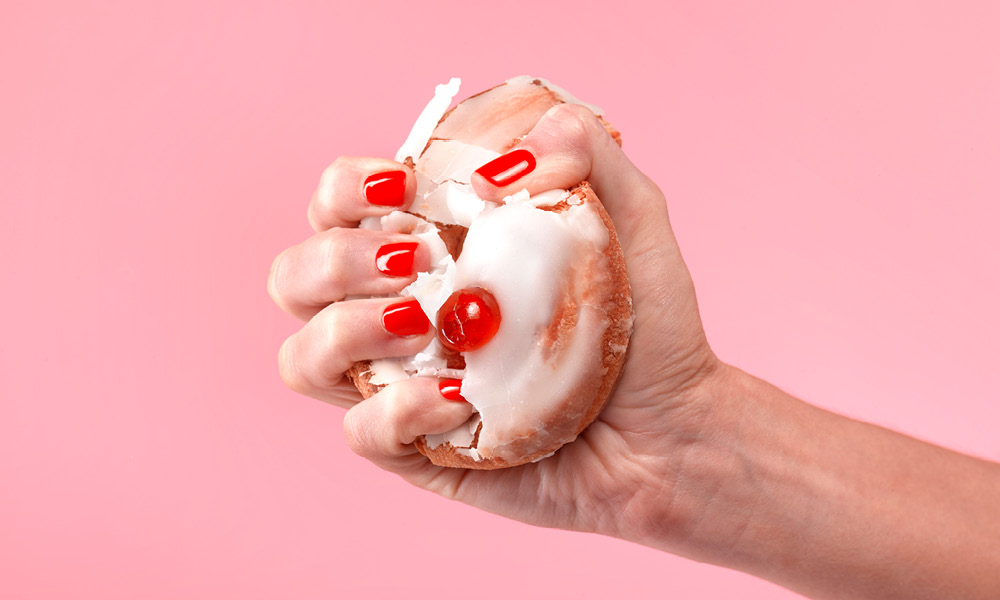 Hand crushing donut