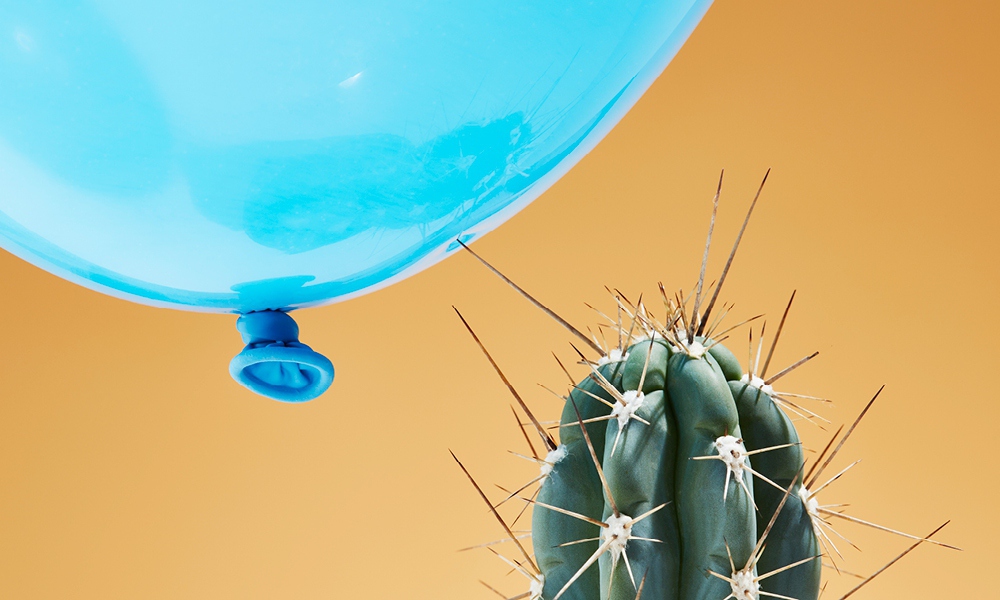 Needles from cactus popping balloon