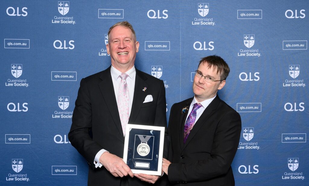 Stephen and Mitchell Page with the QLS President's Medal.