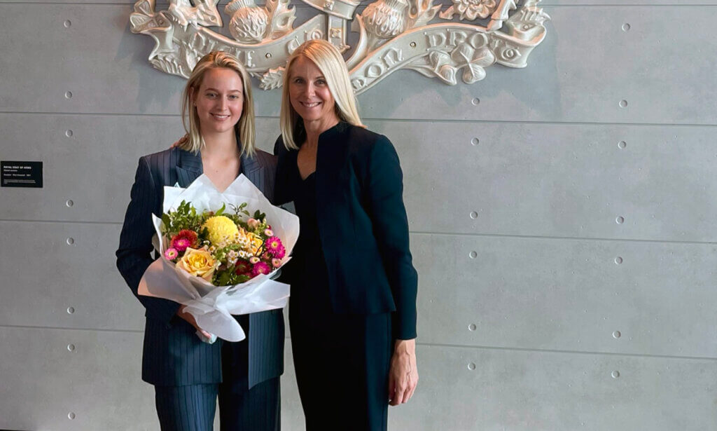 A photo of Emma Josey holding flowers and Penelope Eden who moved her admission